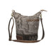 Leather paisley print bag featuring a stylish brown strap for a chic and elegant look.