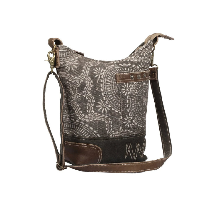 Elegant leather bag with a paisley print and a brown strap, perfect for adding flair to any outfit.
