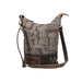 Elegant leather bag with a paisley print and a brown strap, perfect for adding flair to any outfit.