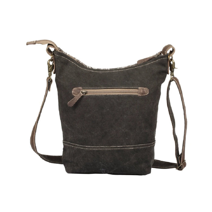 Stylish paisley print leather bag with a brown strap, ideal for both casual and formal occasions.
