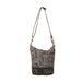 Leather bag adorned with a paisley print, complemented by a brown strap for a sophisticated touch.