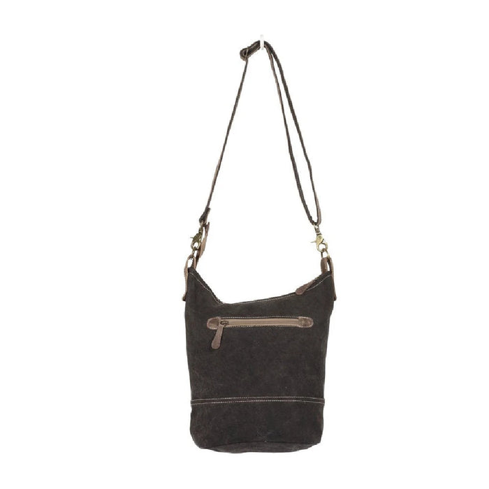 Chic paisley print leather bag with a brown strap, combining style and functionality effortlessly.