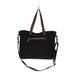 The Myra Bag Mystique Messenger Bag features upcycled woven canvas with rich leather accents. 