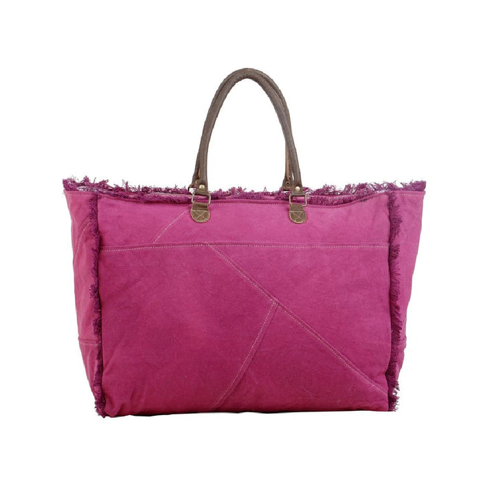 A pink tote bag embellished with a star, perfect for casual outings.