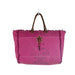 A pink tote bag with a decorative star motif on its surface.