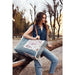 This Myra Bag Venture Weekender Bag features a vintage paisley-inspired printed canvas body in neutral gray tones. 