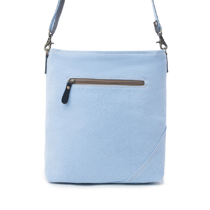 Stylish blue floral print bag crafted from leather, complete with a durable leather strap for easy carrying.