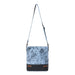 Chic blue floral leather bag with a leather strap, combining functionality and fashion in one accessory.