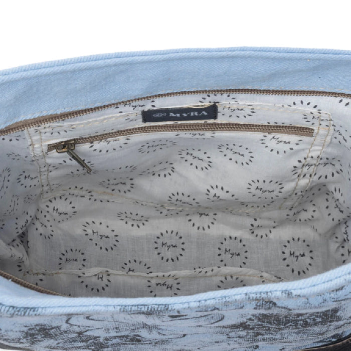 Beautiful blue floral print bag made of leather, equipped with a sturdy leather strap for convenient use.