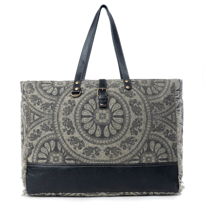 This Myra Carmela Weekender Bag brings together vintage Western charm and practical travel style