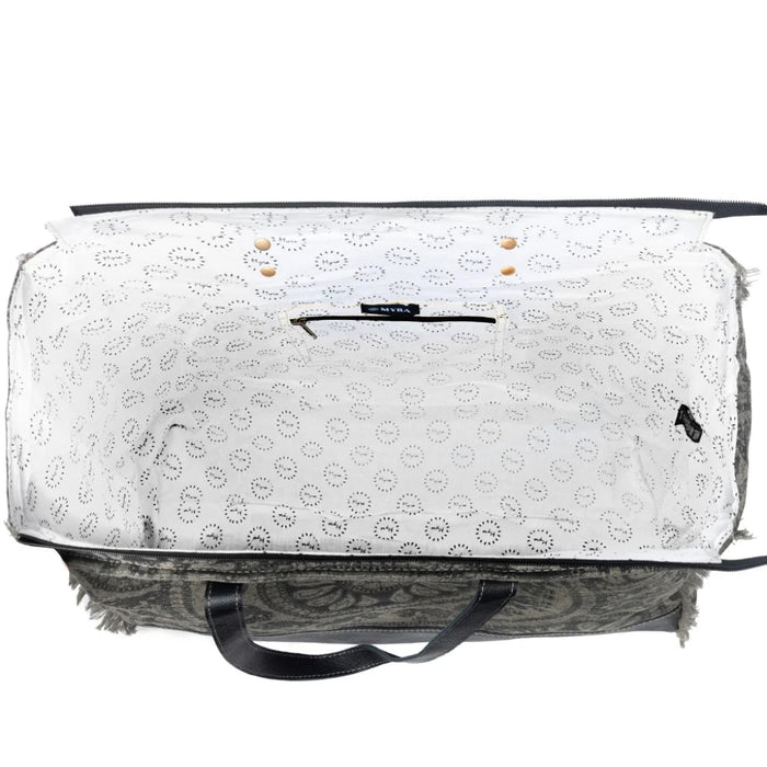 This Myra Carmela Weekender Bag brings together vintage Western charm and practical travel style