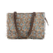 A blue and brown tote bag adorned with a floral design, combining functionality with a chic aesthetic for various occasions.