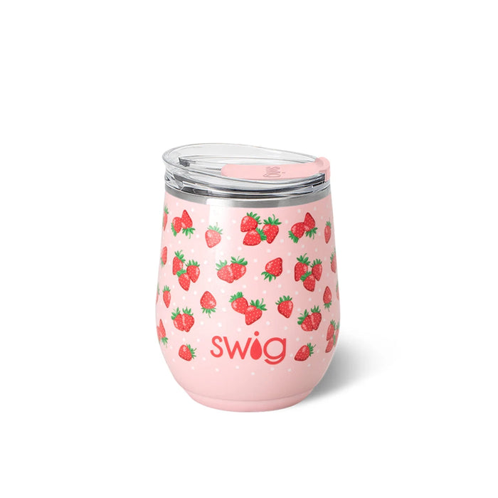 A swig tumbler filled with strawberry wine, showcasing a vibrant pink color and a sleek design.