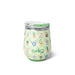  A wine glass topped with a green lid, featuring a decorative garden theme with floral elements.