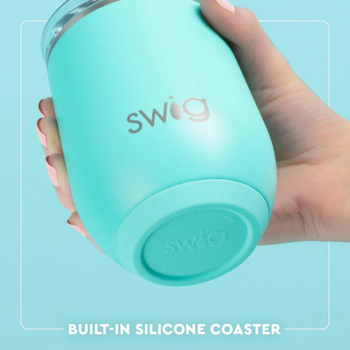 A cheerful Swig beachy tumbler showcasing a bright, tropical design, perfect for summer outings and beach days.