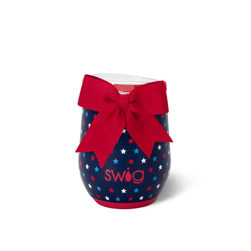 A wine glass adorned with a red bow and scattered stars, creating a festive and elegant appearance.