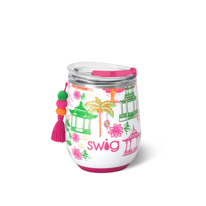 A white wine glass topped with a pink lid and adorned with a tassel, showcasing a unique and stylish design.