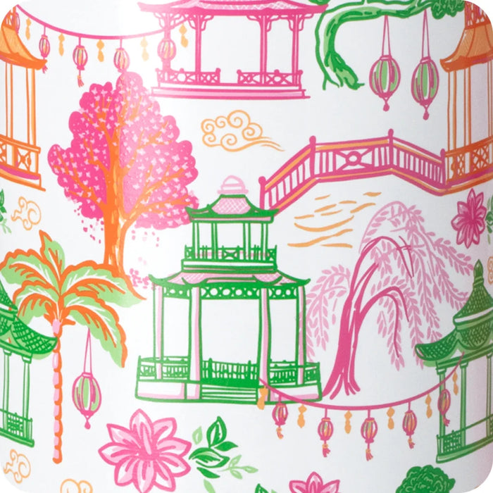 A stylish white wine glass featuring a pink lid and a decorative tassel, adding a touch of elegance to the drinkware.