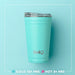 A white tumbler with a green lid, showcasing a playful book pattern, suitable for literary enthusiasts.