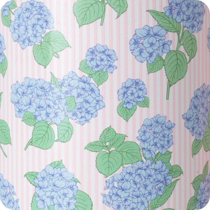 Swoogirls travel mug adorned with a vibrant hydrangea pattern, ideal for enjoying drinks while traveling.