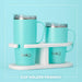 Vibrant travel mug with a beach design, featuring palm trees and ocean waves, perfect for sipping beverages on the go.