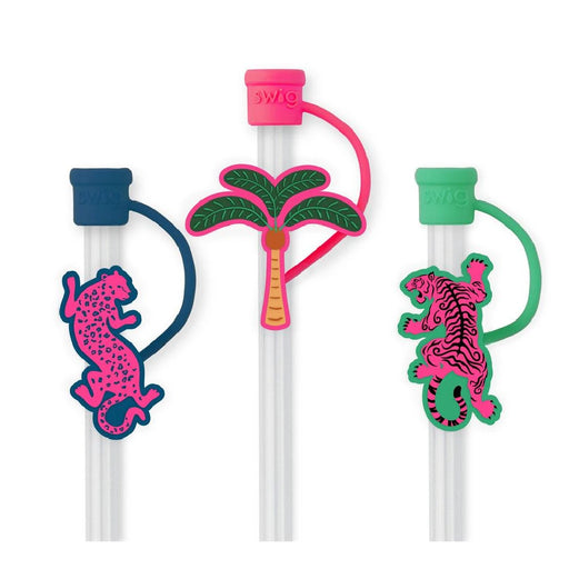 A trio of pens adorned with colorful palm tree and leopard patterns.