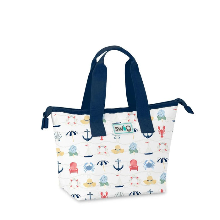 A white tote bag adorned with colorful designs of animals and boats, showcasing a playful theme.