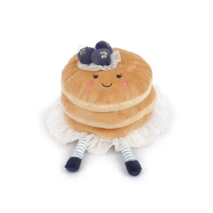 Plush toy resembling a stack of pancakes with a face on a white background