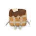 Plush toy resembling a grilled cheese sandwich with a face on a white background