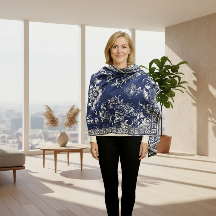 Woman wearing a blue floral patterned scarf on a white background