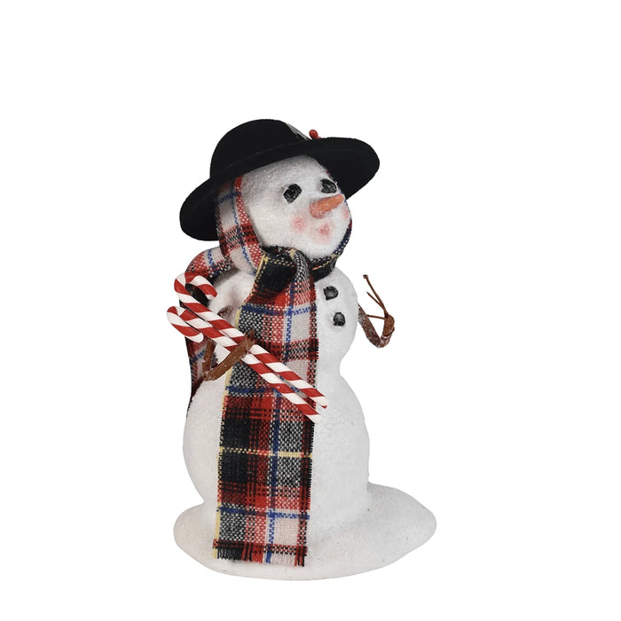 Left side Byres' Decorative snowman figurine with a plaid scarf and black hat  hold candy canes on a white background