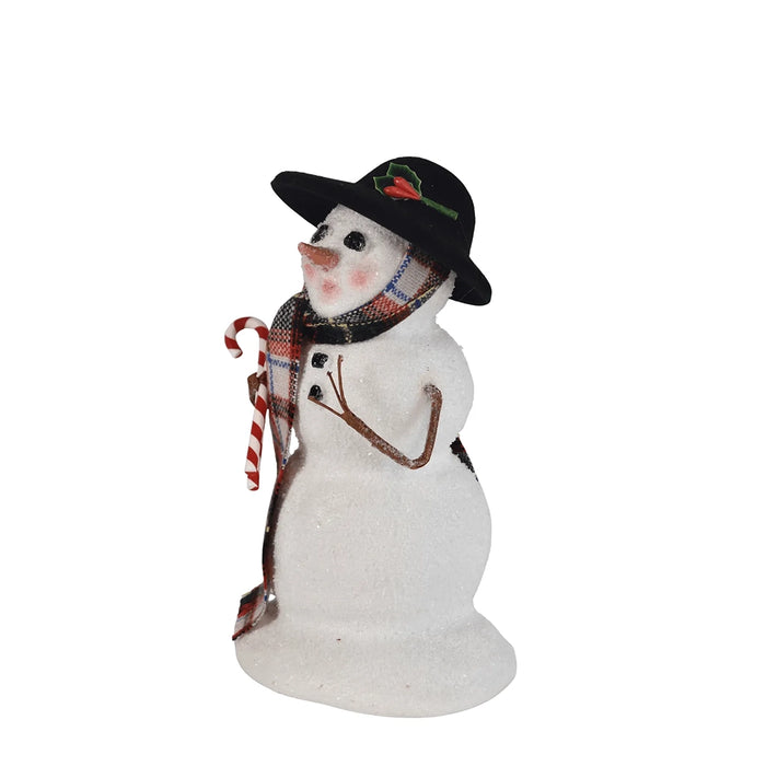 Right side view Byres' Decorative snowman figurine with a plaid scarf and black hat  hold candy canes on a white background