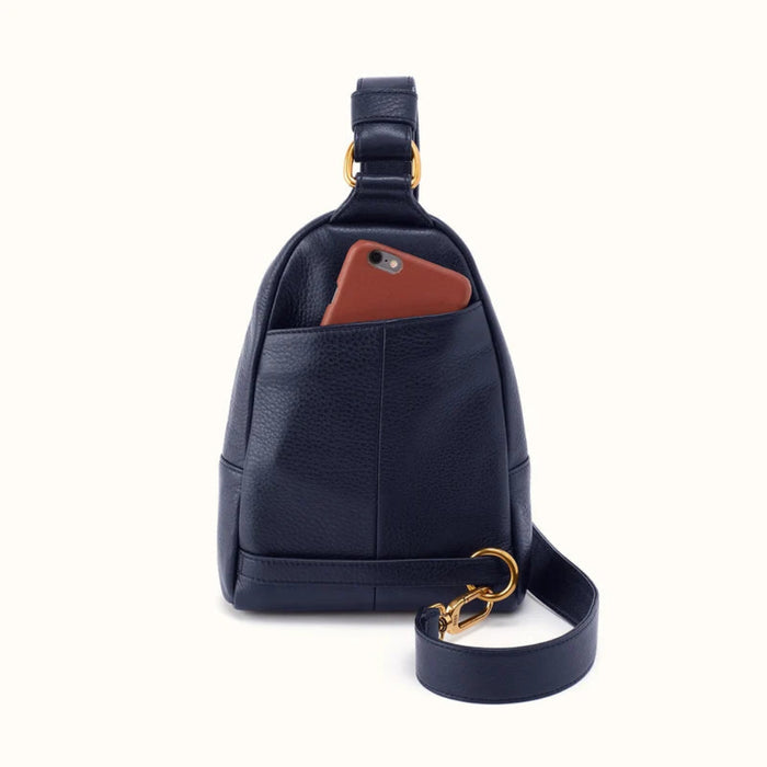 This HOBO Fern Sling in Ink Navy combines modern style with comfortable hands-free convenience. 