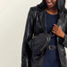 This HOBO Fern Sling in Ink Navy combines modern style with comfortable hands-free convenience. 