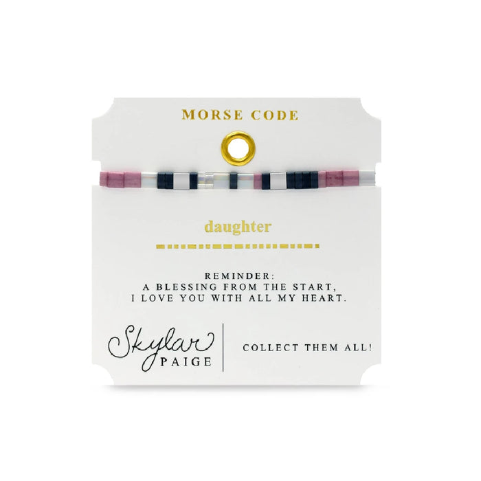 A beaded bracelet showcasing a mix of black, white, and pink beads in an elegant design.