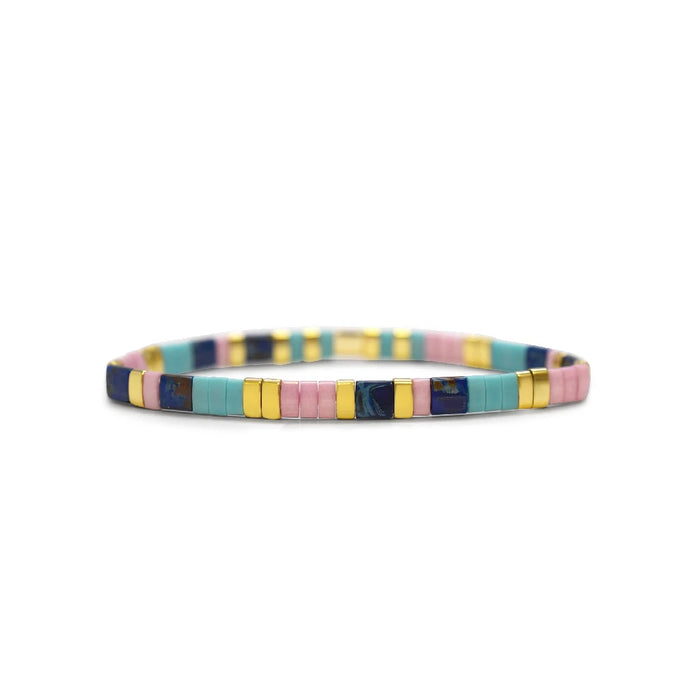A multi-colored bracelet featuring gold and blue beads, showcasing a vibrant and elegant design.