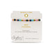  A stylish bracelet made of gold and blue beads, displaying a colorful and eye-catching pattern.