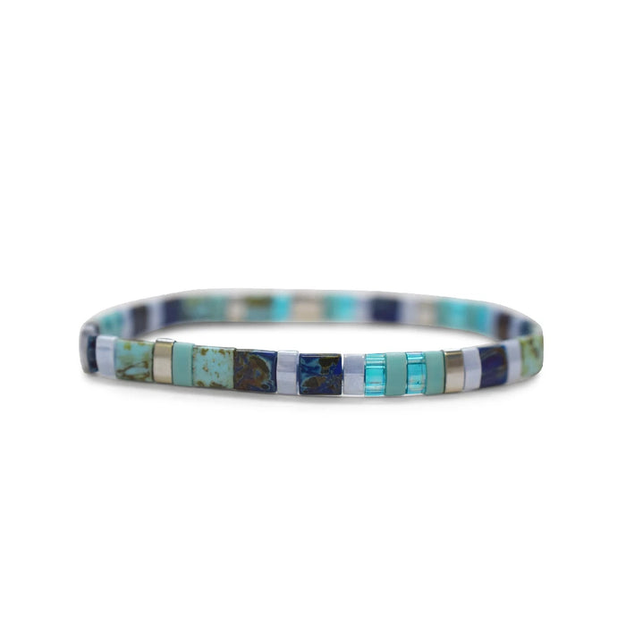 A blue and white bracelet featuring a square design, showcasing a modern and stylish accessory.
