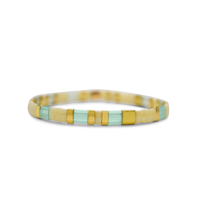 A colorful bracelet crafted from yellow and green glass beads, showcasing a unique design.