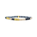 A bracelet featuring striped fabric and gold-tone metal accents, showcasing a stylish and modern design.