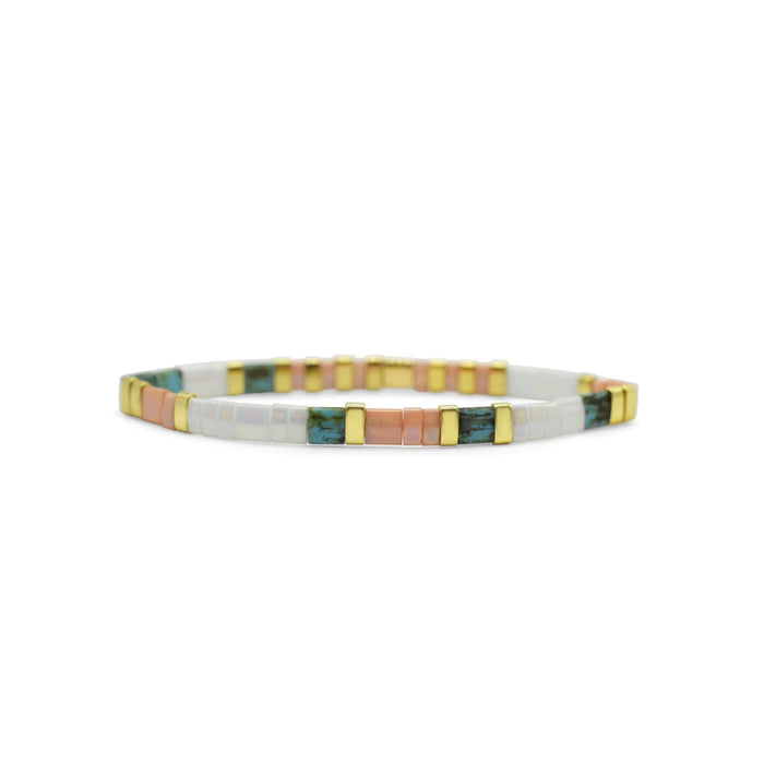  Multi-colored bracelet featuring gold and white enamel, showcasing a vibrant and elegant design.