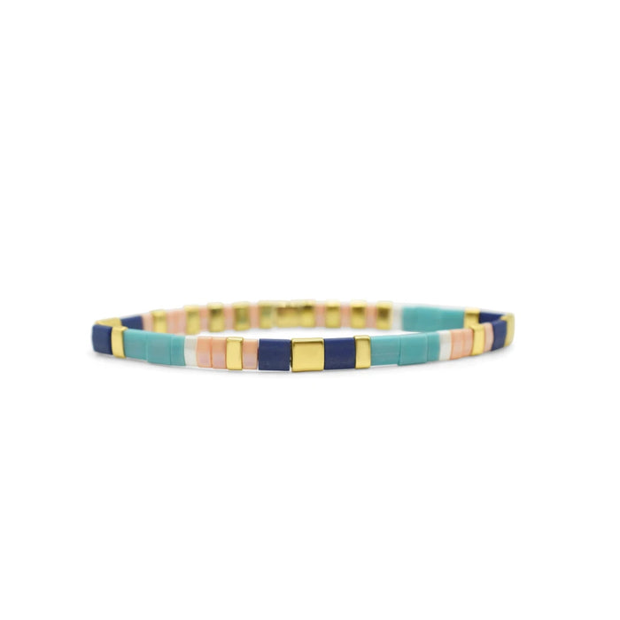 Multi-colored square bracelet made of gold-plated brass, showcasing a vibrant design and elegant craftsmanship.