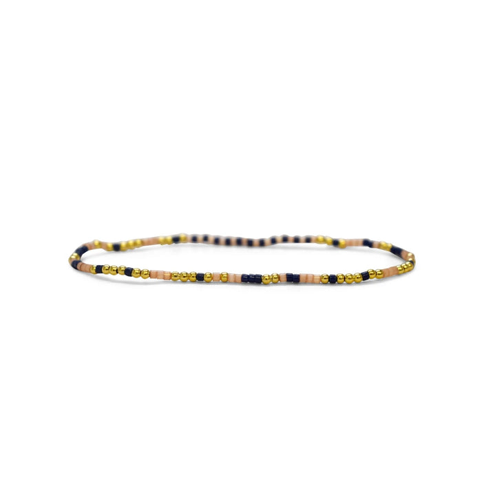 Beaded bracelet featuring a combination of wooden and gold beads, showcasing a natural and elegant design.