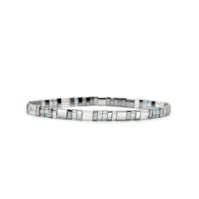 A bracelet featuring alternating white and black stones, elegantly arranged for a striking contrast.