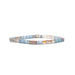 A bracelet featuring an arrangement of blue and white glass beads, showcasing a delicate and colorful design.