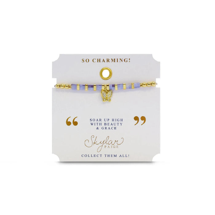 A stylish gold bracelet adorned with a tiny diamond charm, perfect for adding a touch of elegance to any outfit.