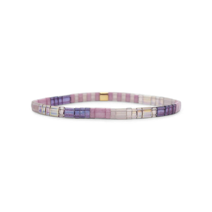 A purple and white bracelet featuring a gold clasp, elegantly designed for a stylish accessory.