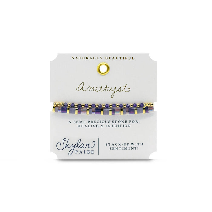 A stylish gold bracelet featuring purple stones, highlighting a luxurious and eye-catching accessory.