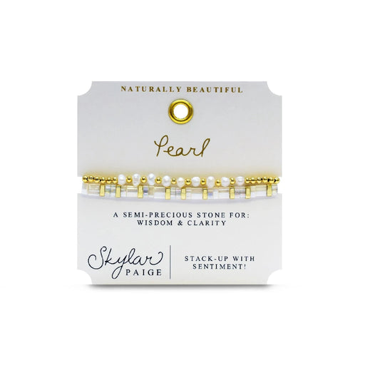 A stylish bracelet adorned with gold beads and pearls, showcasing a blend of luxury and elegance.