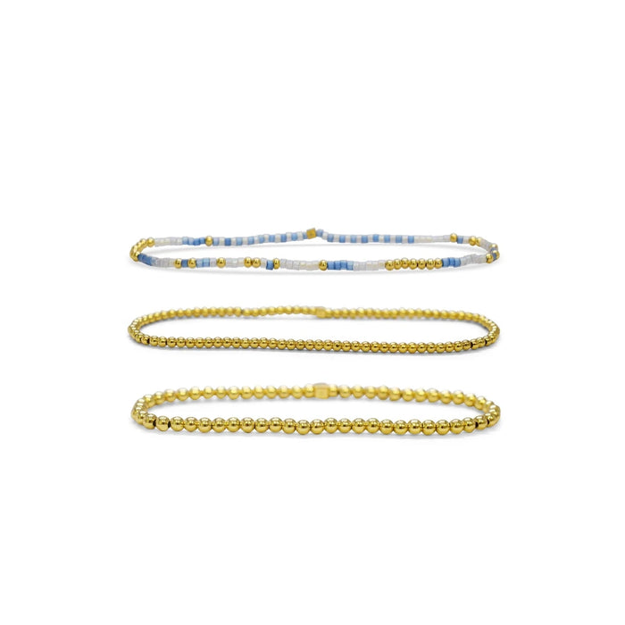 Gold and blue bracelet featuring the phrase "the two shall pass" elegantly designed for a meaningful statement.
